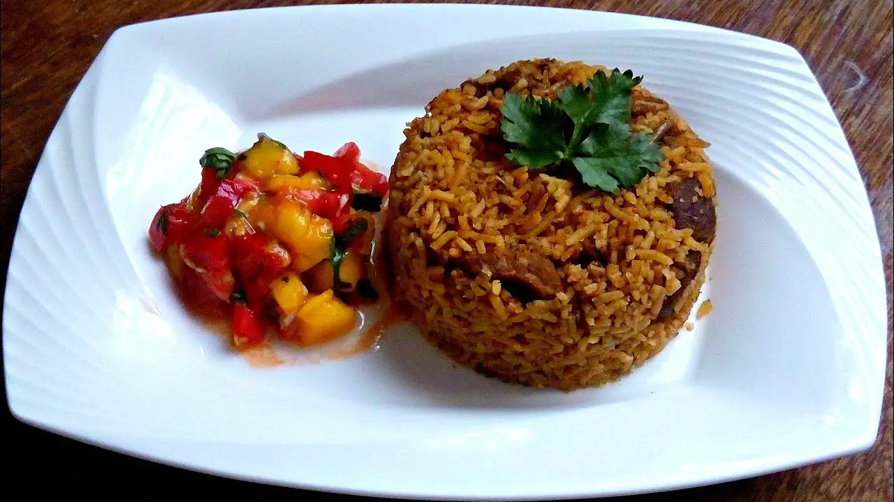 Brown pilau served with sauce